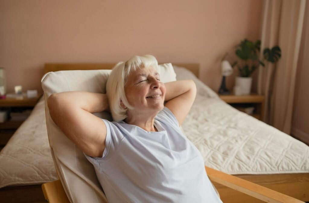 A senior woman relaxing in a comfortable chair.